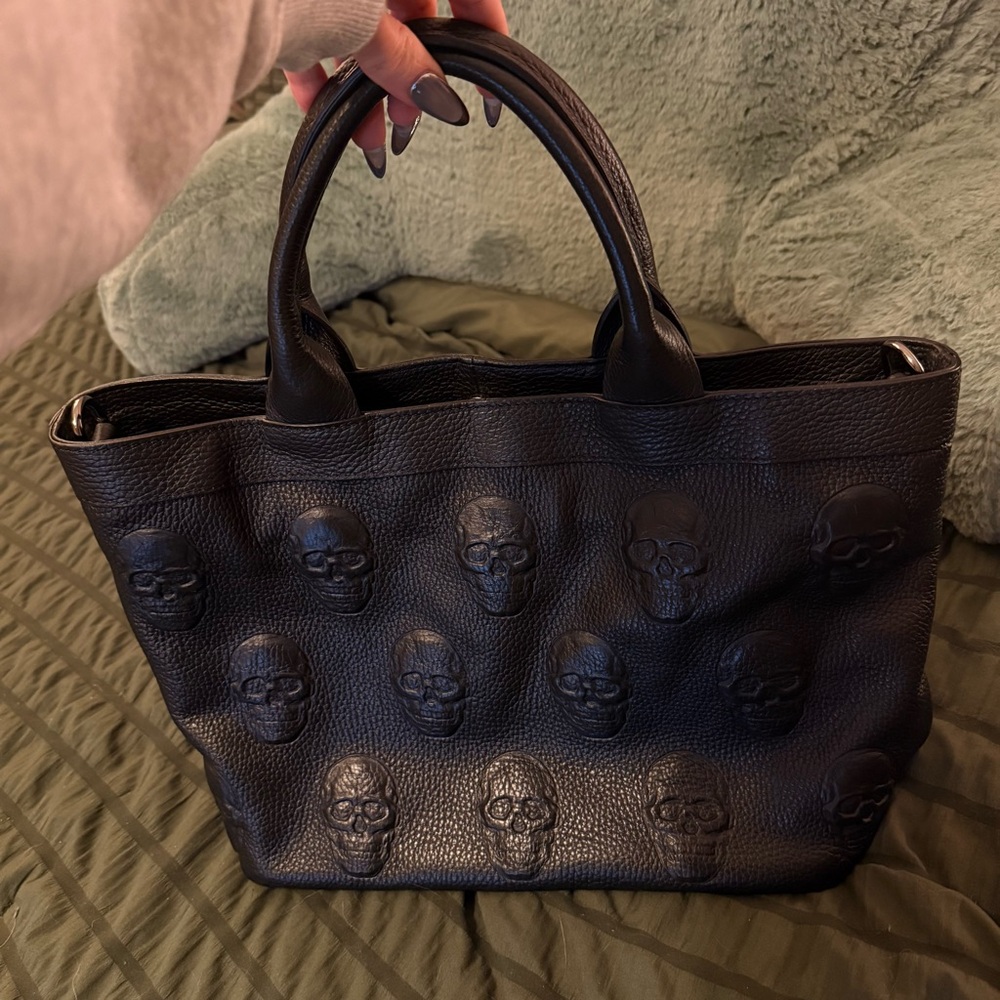 Iopelle skull embossed handbag